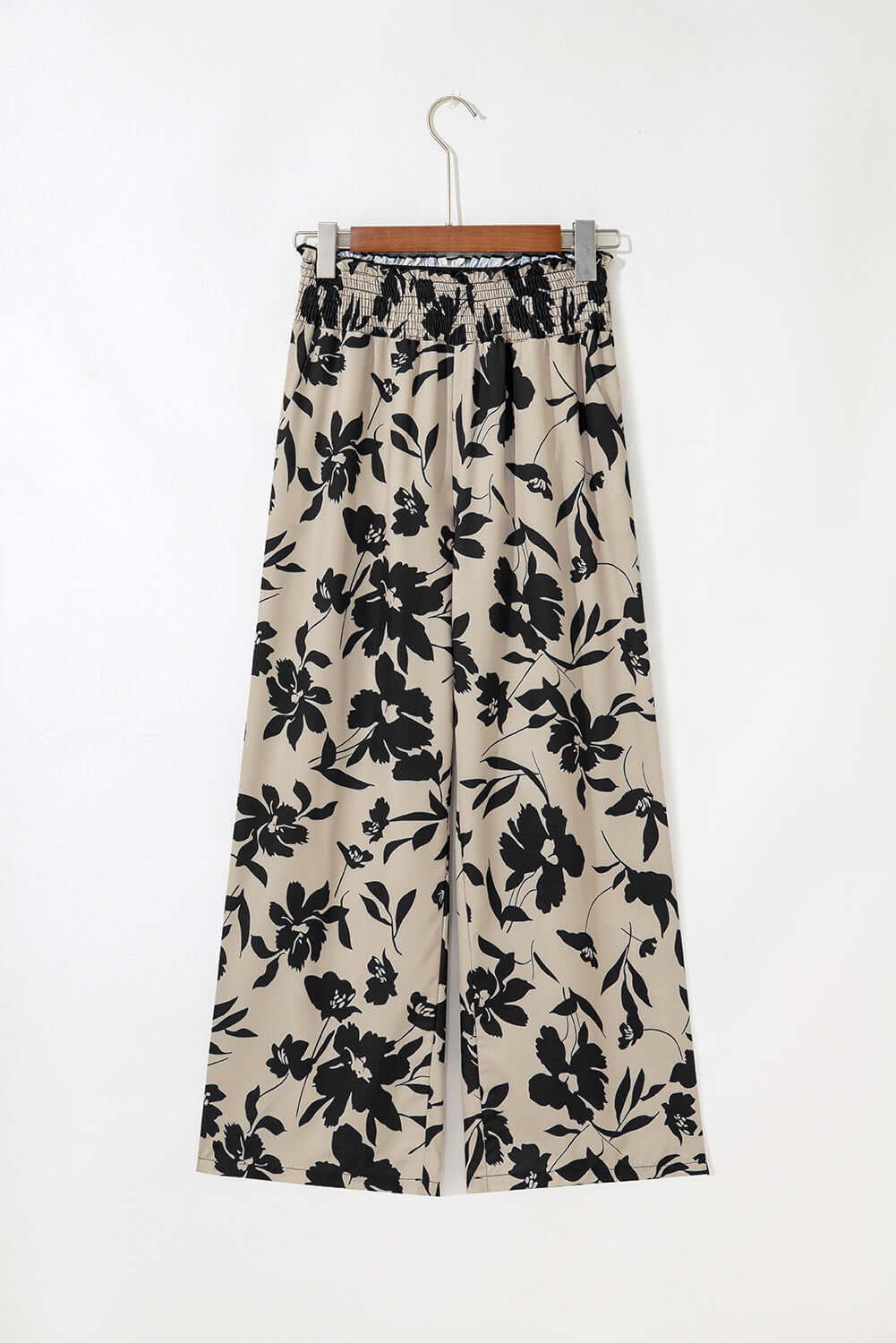 Floral pant with frill waist and wide-leg design from Chic Speak Boutique, featuring a colorful floral pattern and relaxed fit.