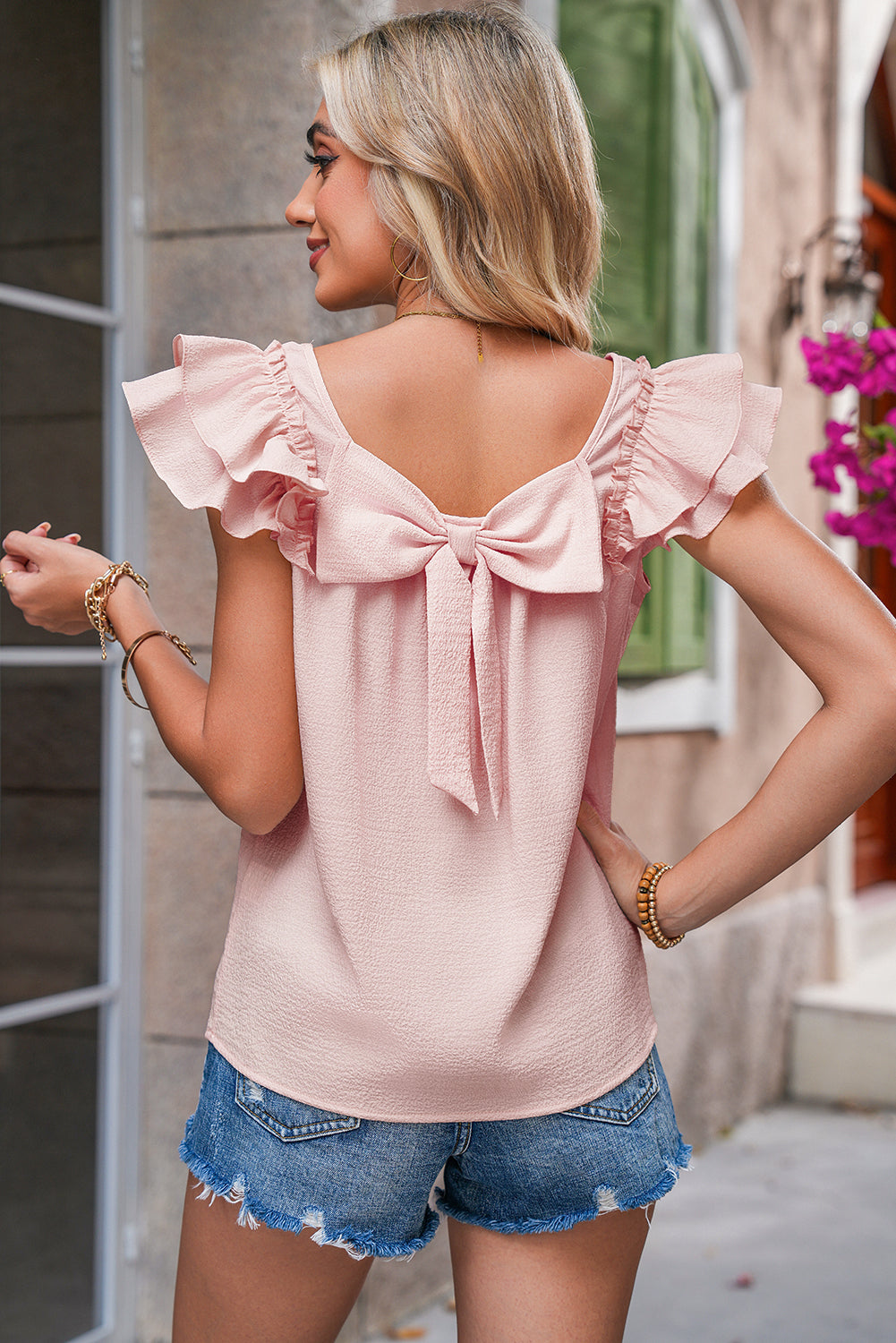 Pink bow blouse for ladies from CSB Private Label, featuring a stylish design with a feminine bow detail.