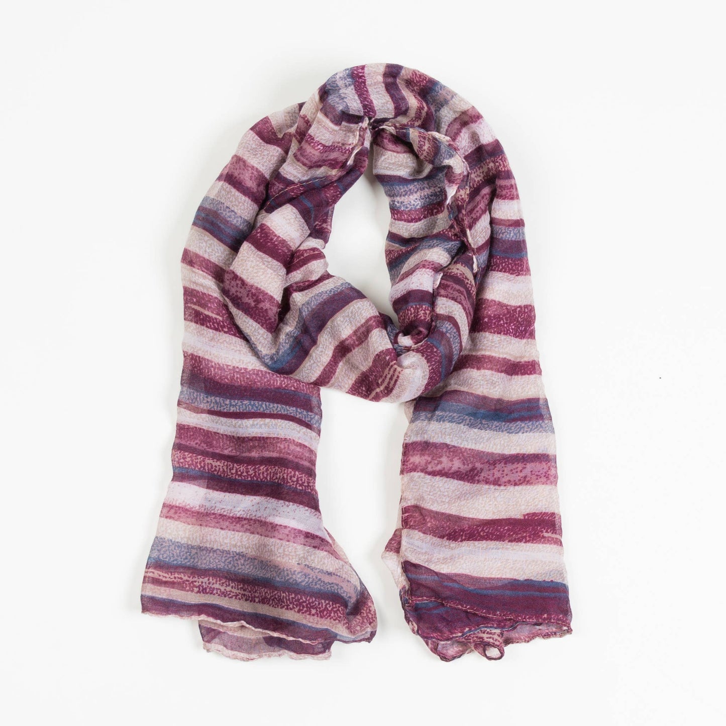 Howard's Dayton lightweight striped sheer scarf draped elegantly, showcasing its soft, airy fabric and stylish striped pattern.