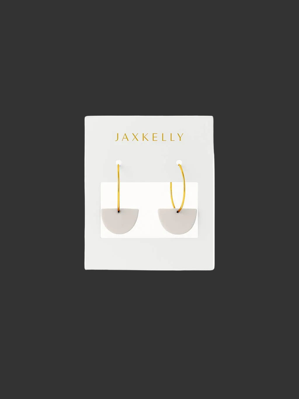 Jax Kelley clay half moon sculpture in oat milk color, showcasing smooth, matte finish and modern design.