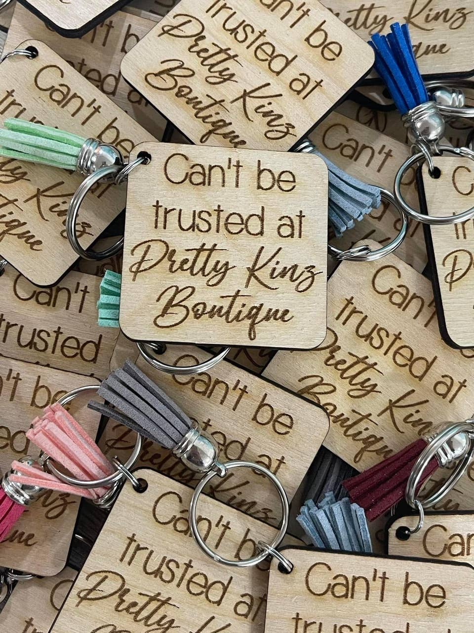 Lasting Impressions Can't Be Trusted keychain with metal charm and engraved text, casual accessory for keys or bags.