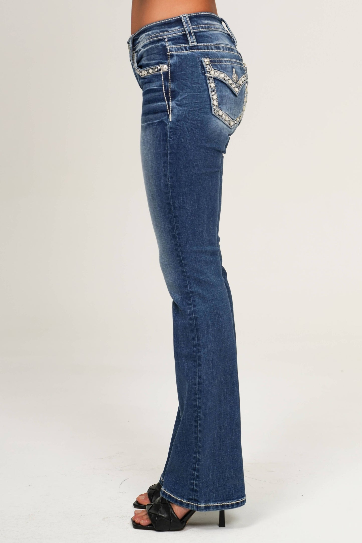 Miss Me 30 Mid Rise Boot Cut Jean in style M9517BS, showcasing classic denim with a fitted waist and flared leg silhouette.