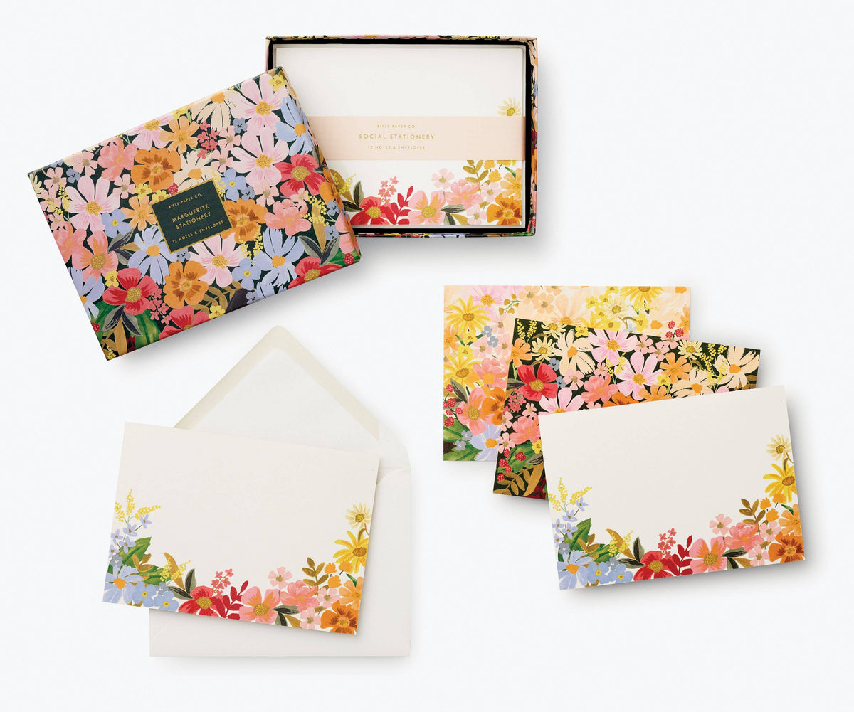 Rifle Paper Company Marguerite stationery set with floral patterned notecards and matching envelopes on a white background.