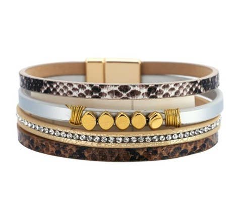 Tan and white leather strap bracelet with beads and crystals from S & A Fashions, showcasing a stylish multi-layered design with decorative accents.