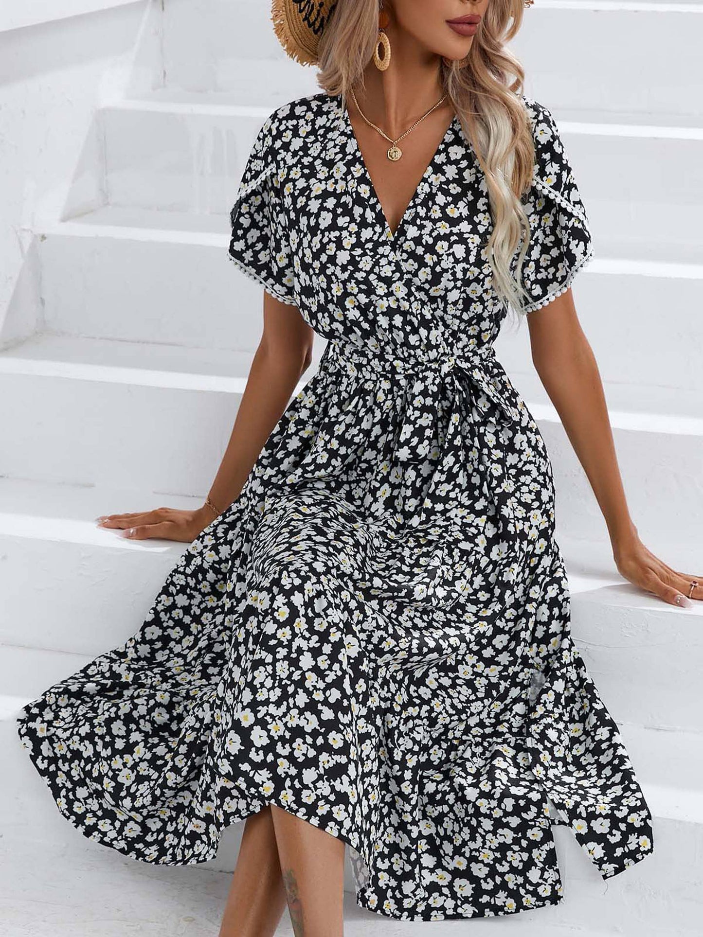 Floral split V-neck dress by Wholesalesir featuring a flowy fabric, vibrant floral pattern, and stylish V-neck design.