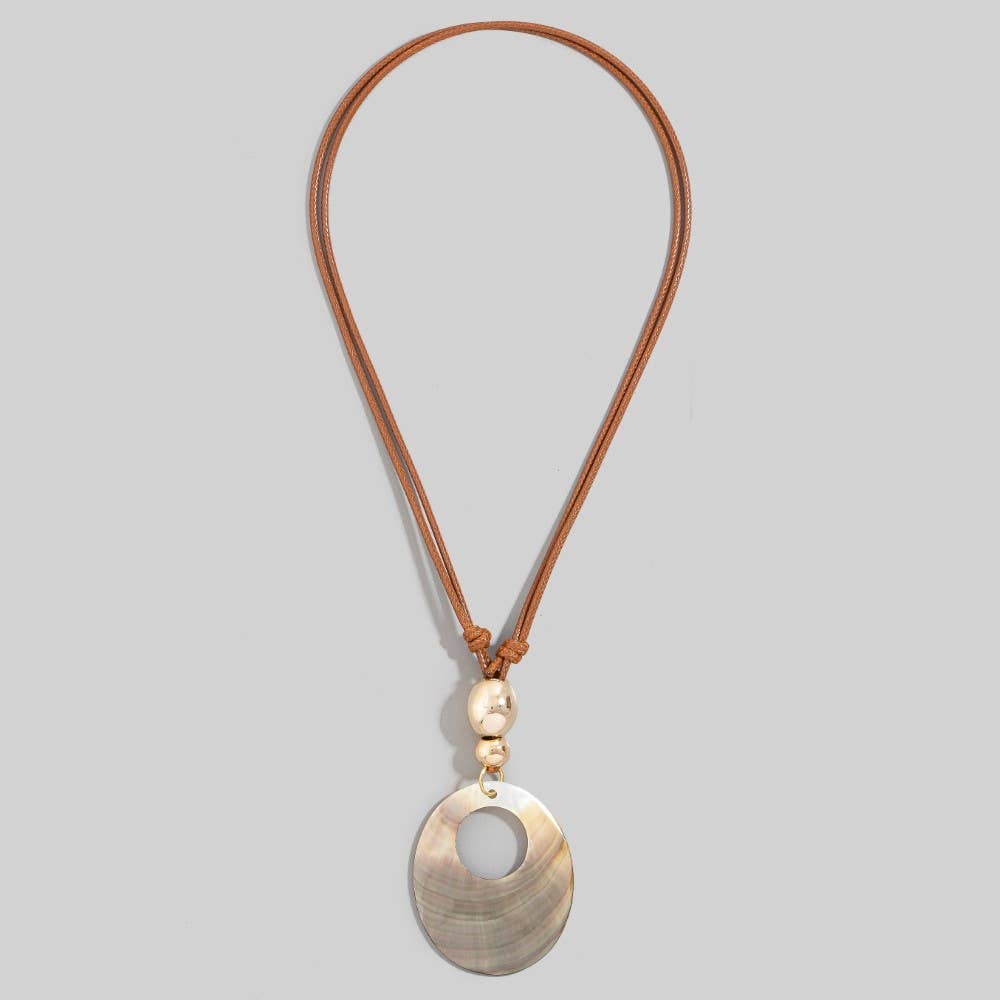 Necklace with a gold pendant on a light gray background