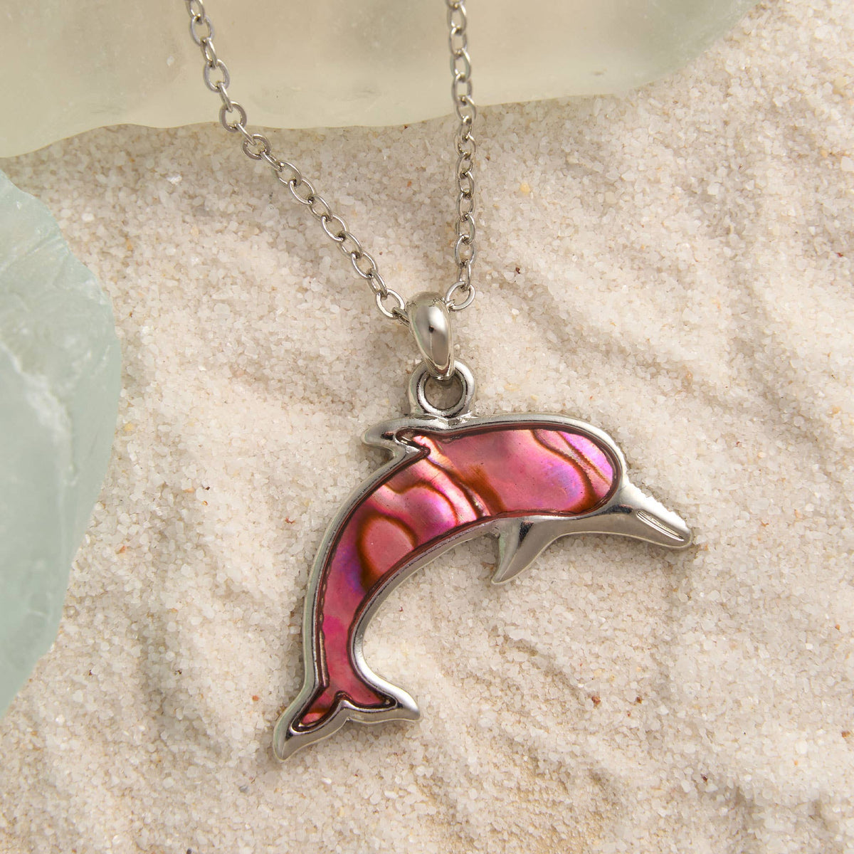 Abalone shell dolphin pendant necklace from Howard's beach jewelry, featuring a colorful dolphin design on a chain.
