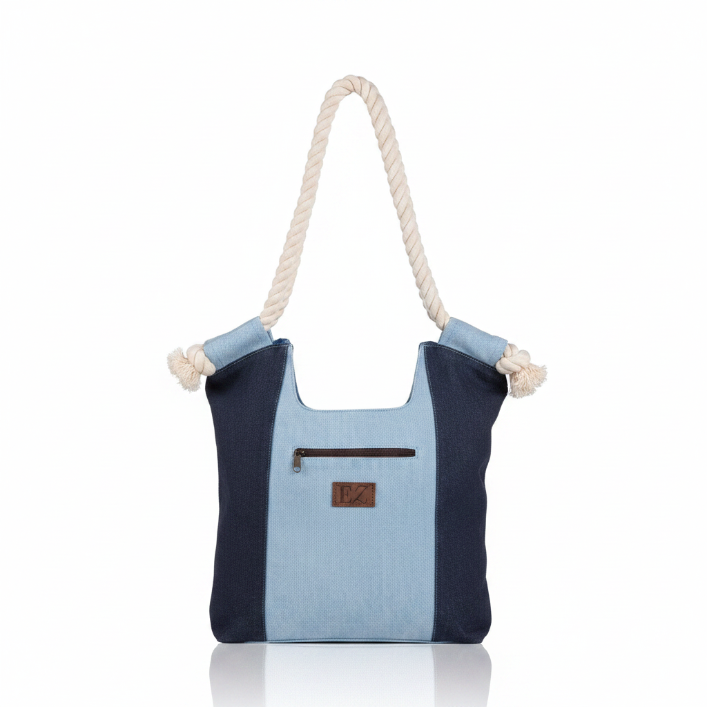 Howard's Nikole patchwork denim handbag with top handle and adjustable strap, featuring a stylish patchwork design.