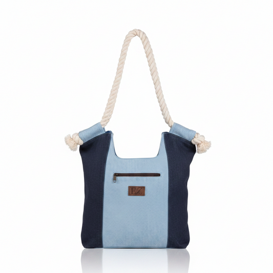 Howard's Nikole patchwork denim handbag with top handle and adjustable strap, featuring a stylish patchwork design.