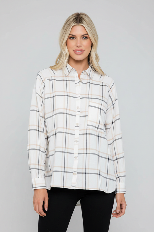 Oversized cotton plaid shirt with raglan sleeves by 26 International, shown open with a window in the background.