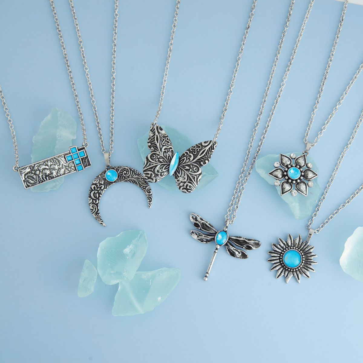 Silver butterfly pendant necklace with engraved antique design on an 18-inch chain, showcasing Howard's Zenni brand jewelry.