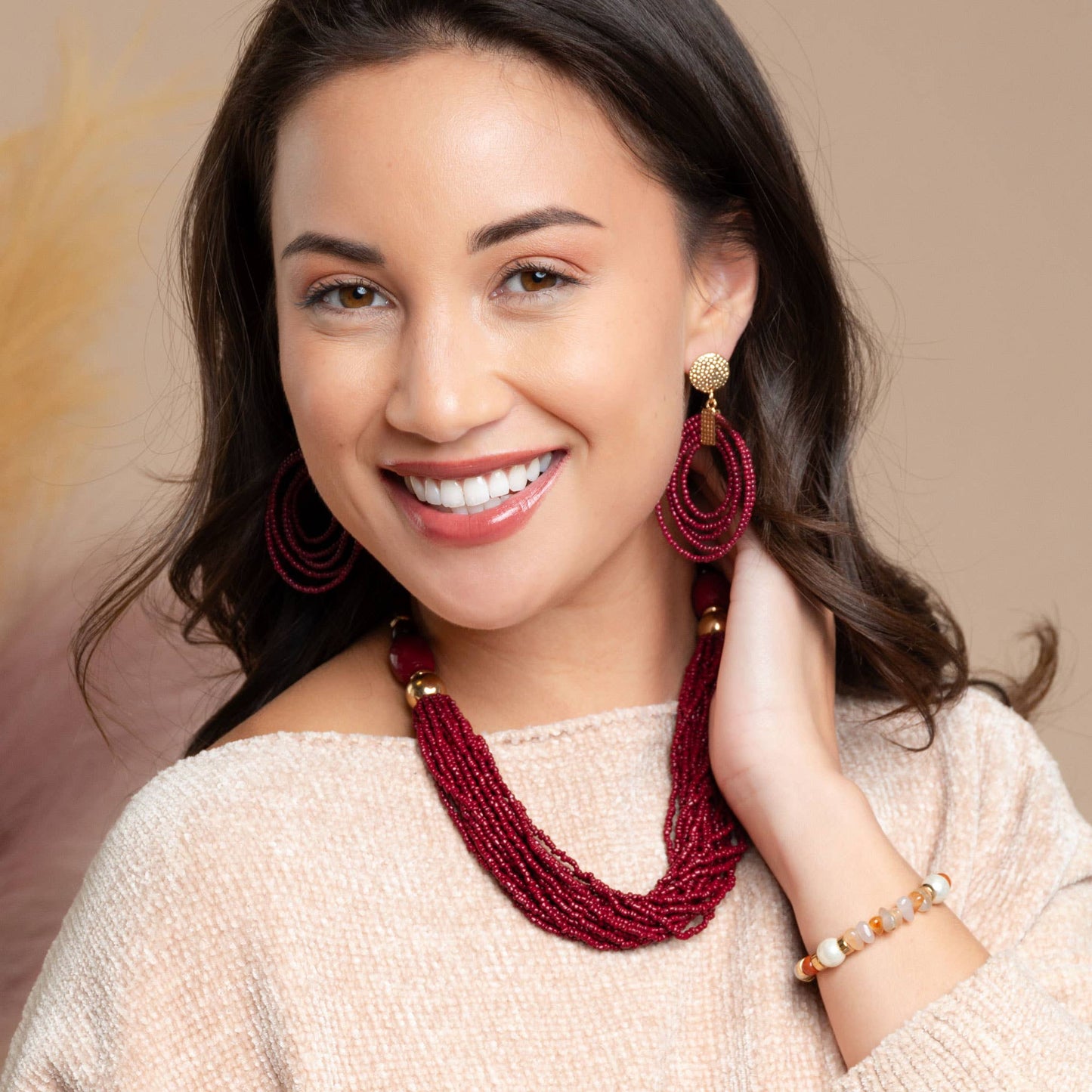Howard's hoop seed bead nickel-free drop earrings with colorful seed bead details and silver-toned hoop design.