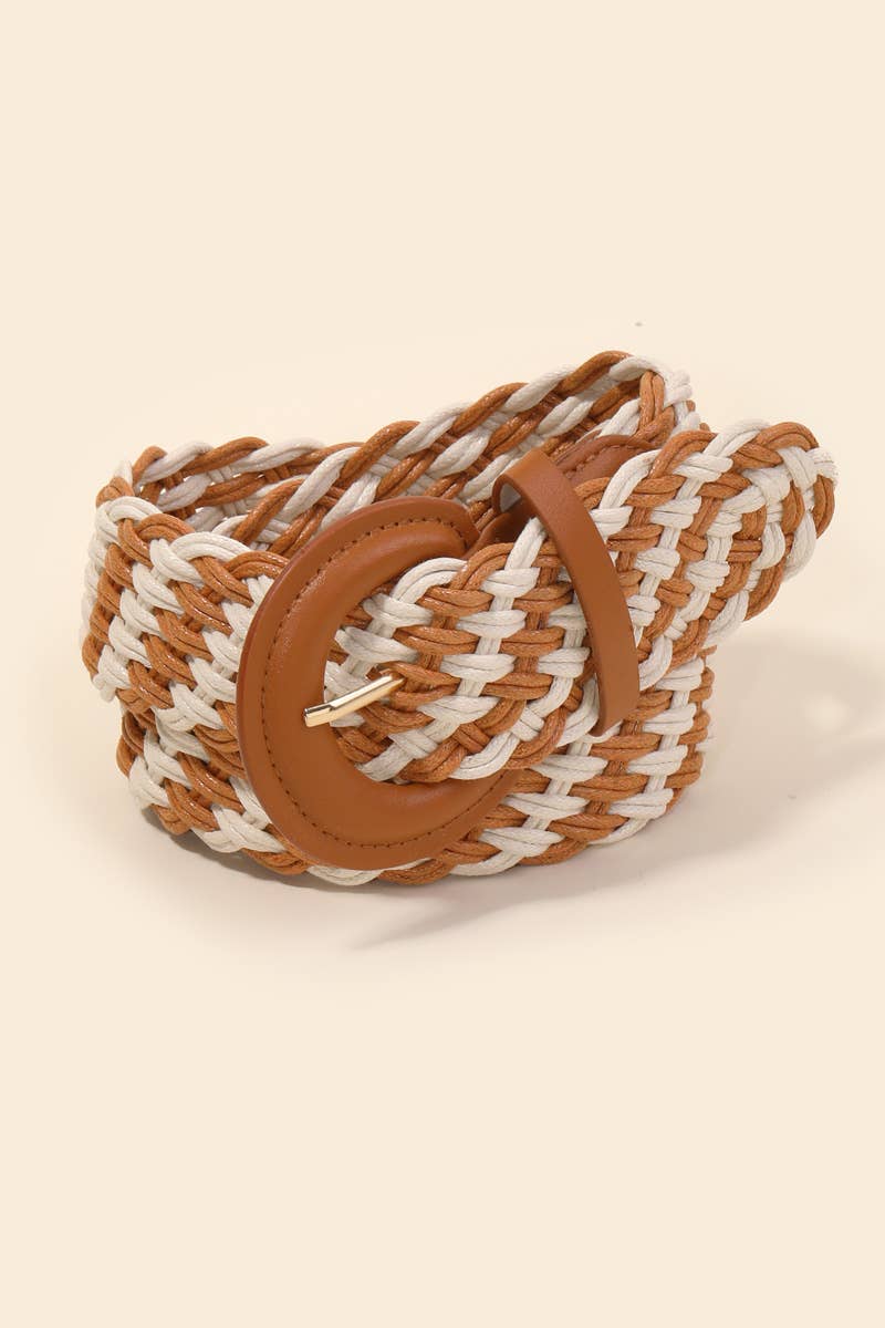 Woven belt with brown and white straps on a beige background