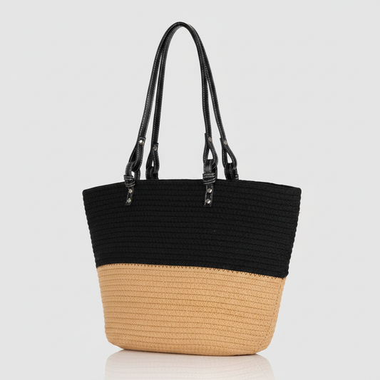 Elsie & Zoey woven beach tote bag with tan leather handles and spacious interior, perfect for summer outings and beach trips.
