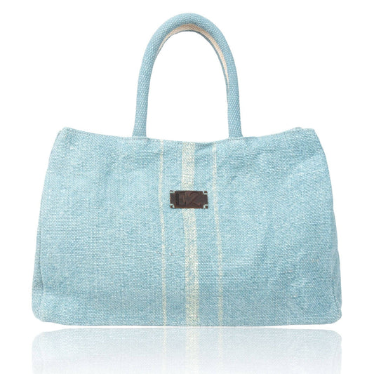 Inara Jute Handled Tote Bag with snap closure by Howard's, featuring natural jute material and stylish design.