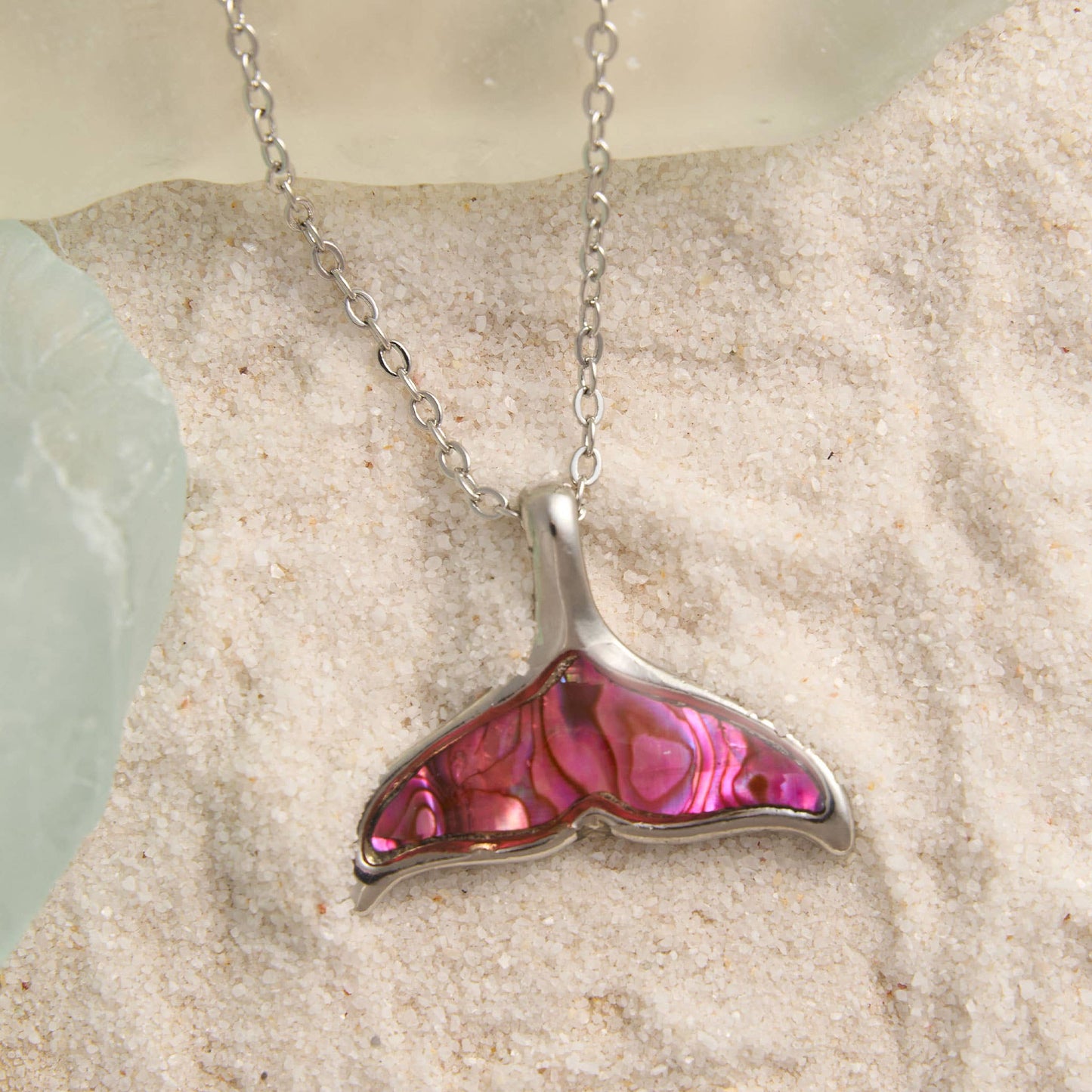 Howard's abalone shell whale tail pendant necklace featuring a colorful, glossy whale tail design on a beach jewelry style chain