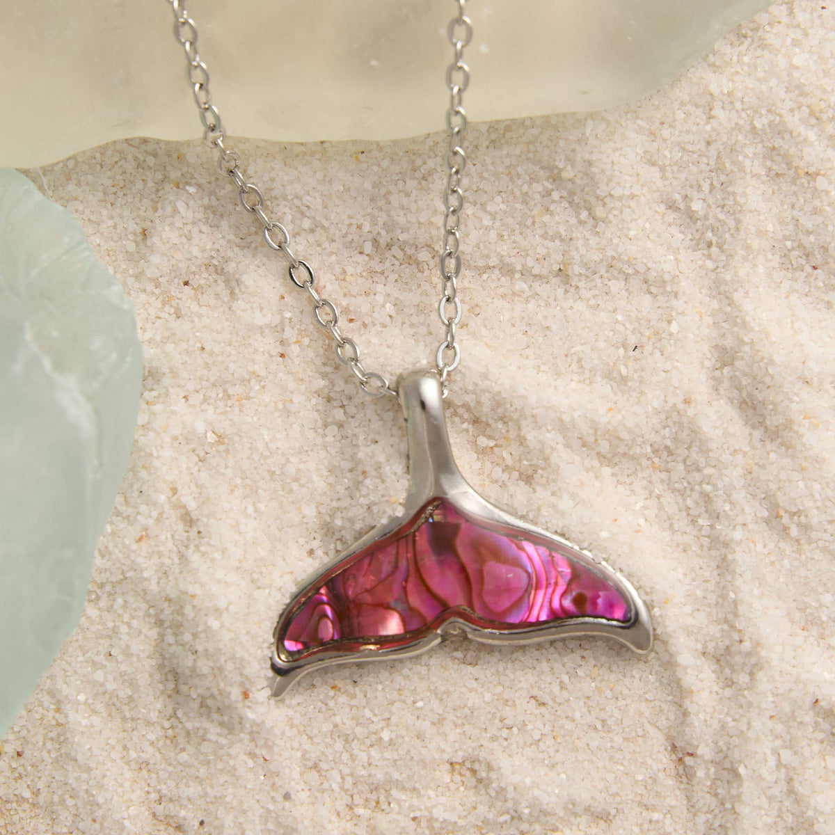 Howard's abalone shell whale tail pendant necklace featuring a colorful, glossy whale tail design on a beach jewelry style chain
