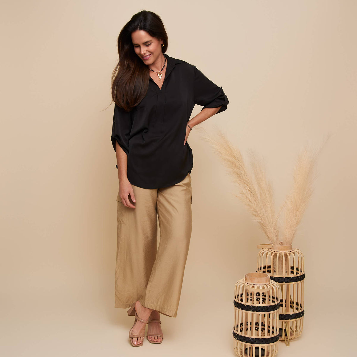 Elsie & Zoey Amaris blouse top with collar, relaxed fit, half sleeves, and V-neck, shown in a natural fabric and fit.