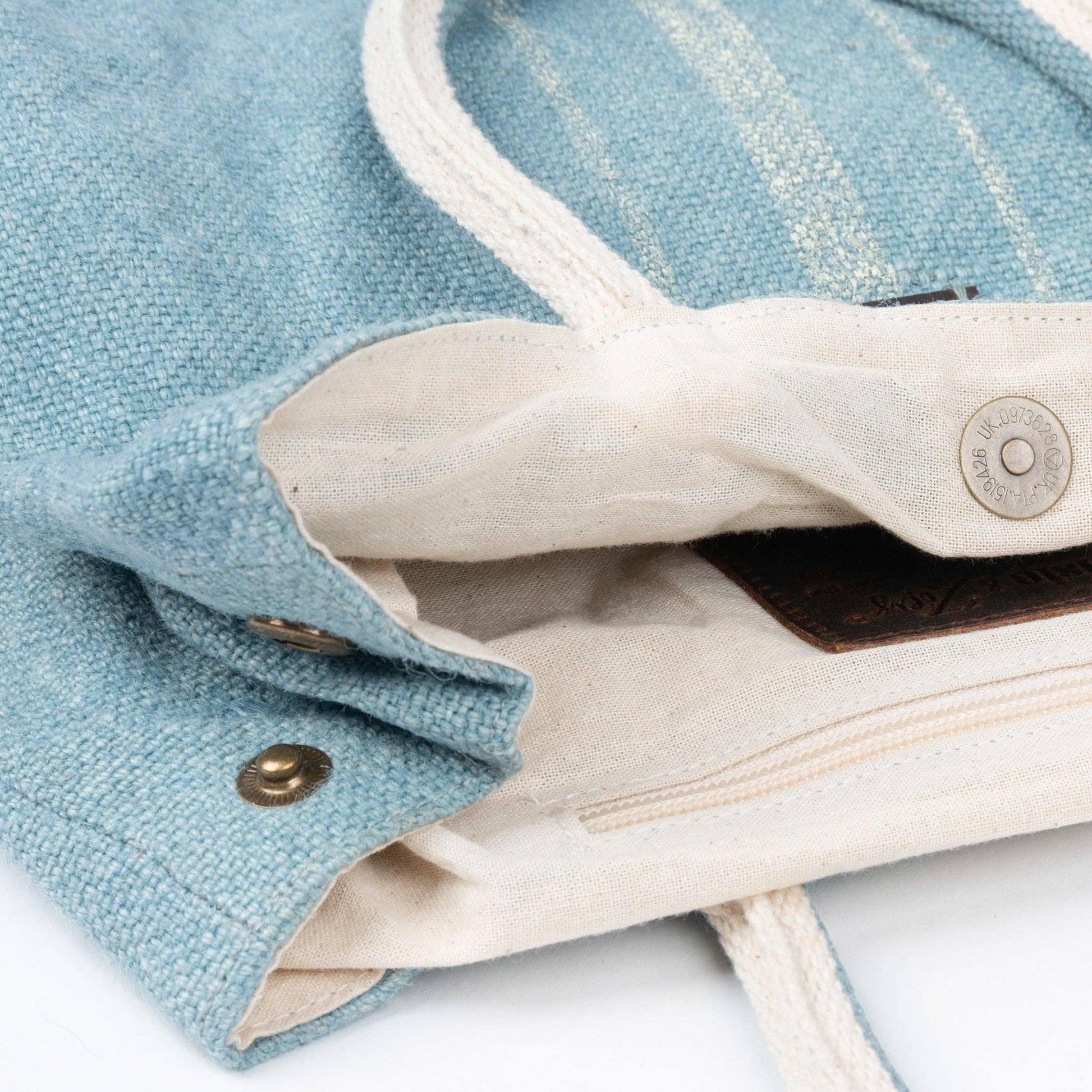 Howard's Inara jute tote bag with snap closure, featuring sturdy handles and eco-friendly design for everyday use.