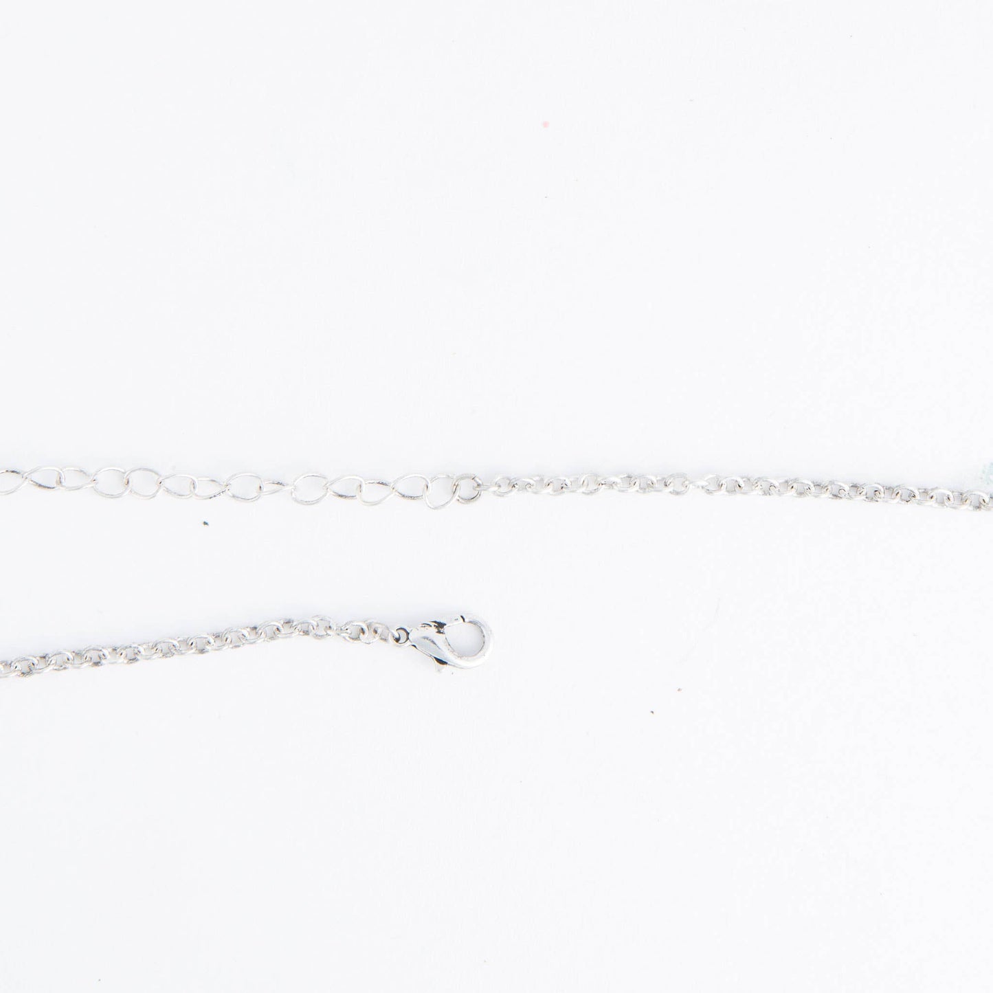 Howard's Zenni engraved antique silver butterfly pendant necklace on an 18-inch chain, featuring detailed butterfly engraving.