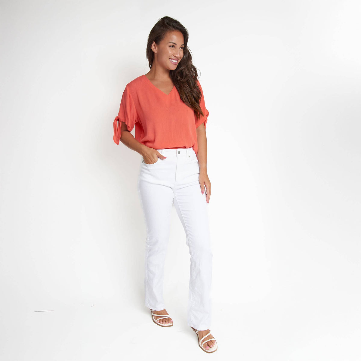 Elsie & Zoey Nika crepe short sleeve blouse with V-neck and tie detail, featuring a stylish and comfortable design.
