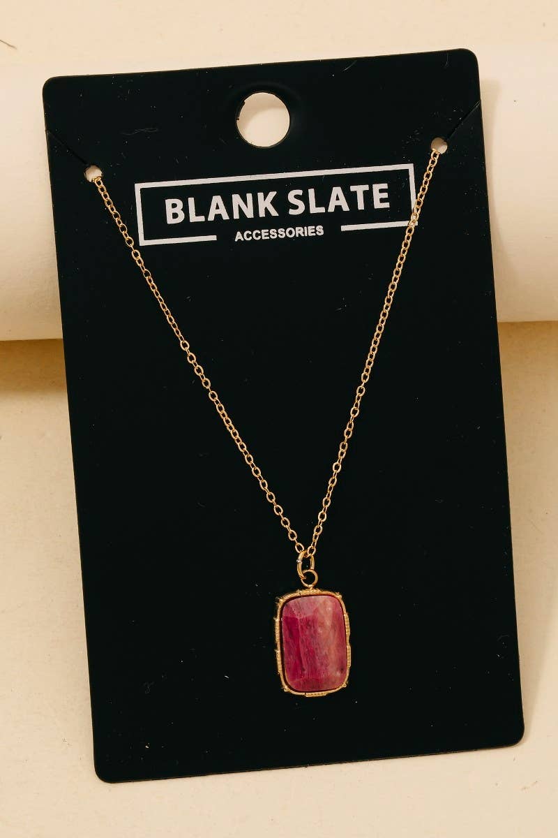 Necklace with a pink pendant on a 'Blank Slate' branded card.