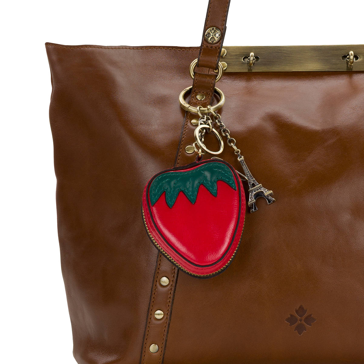 Vintage distressed leather strawberry zip around pouch by Patricia Nash showing the detailed leather texture and strawberry design.