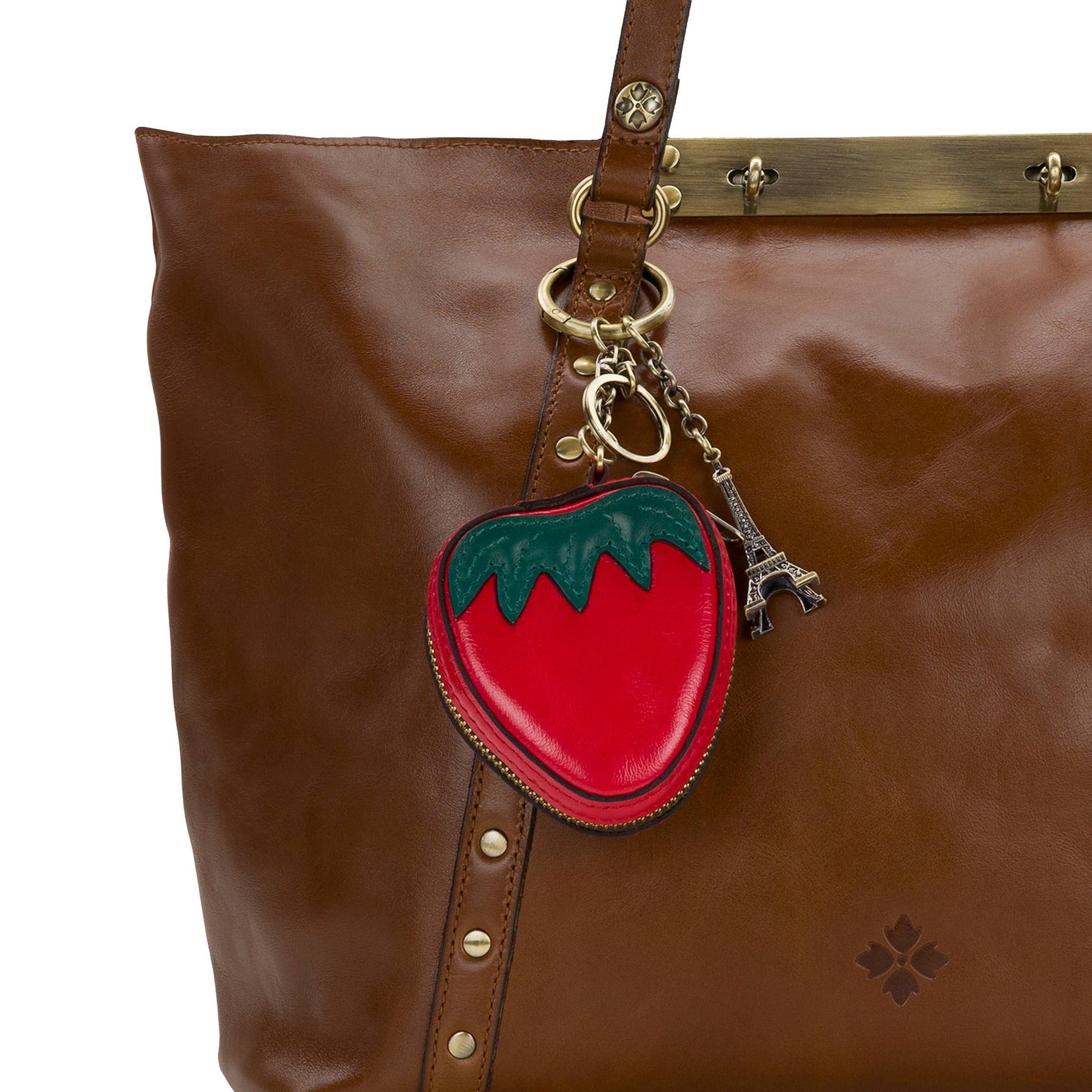 Vintage distressed leather strawberry zip around pouch by Patricia Nash showing the detailed leather texture and strawberry design.