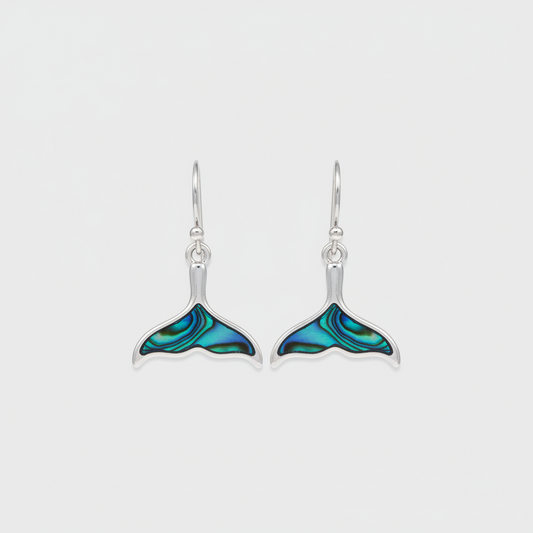 Elsie & Zoey abalone blue whale tail earrings with beach jewelry design featuring iridescent blue and shell details.
