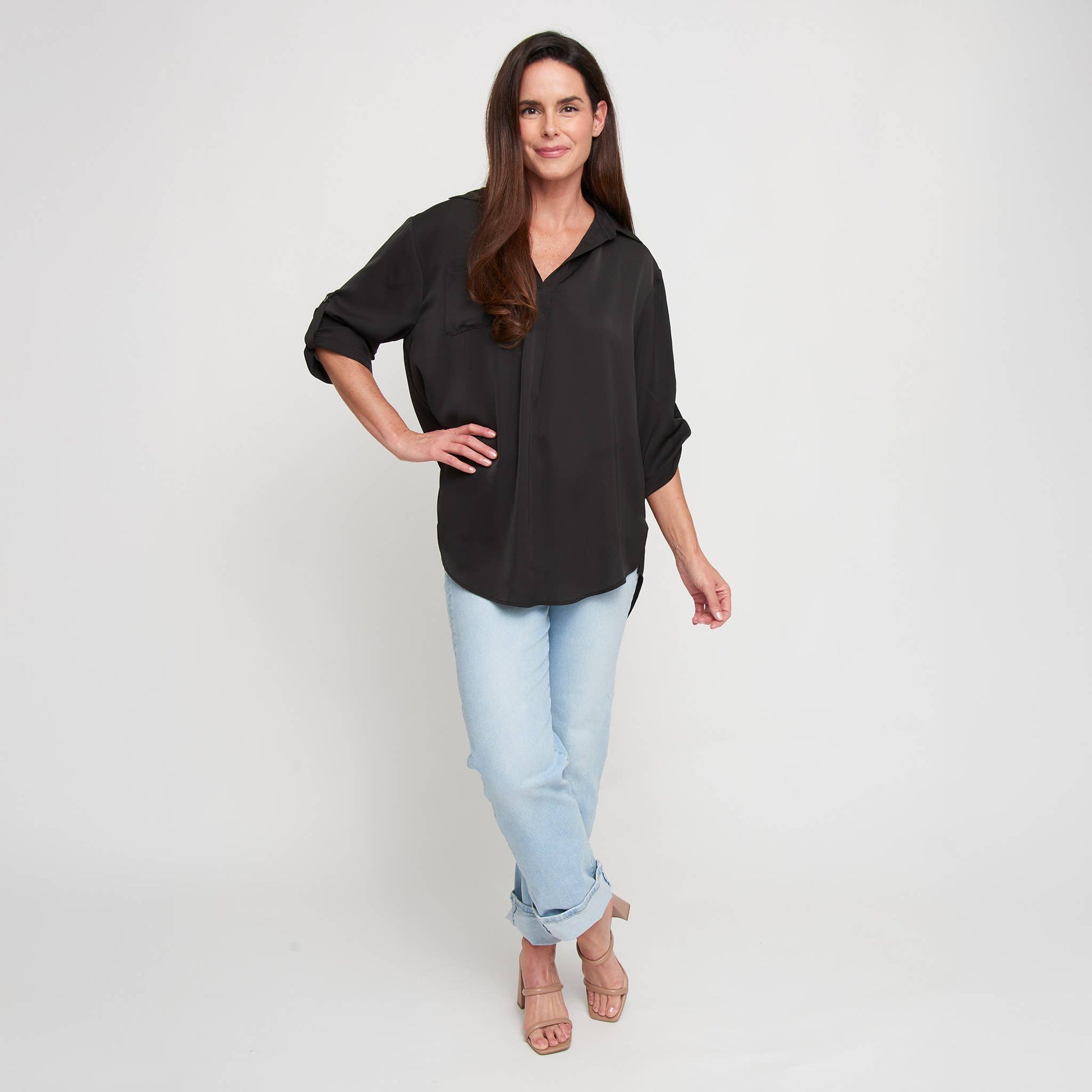 Elsie & Zoey blouse top with collar, relaxed fit, half sleeves, and V-neck, shown in a stylish, casual outfit.