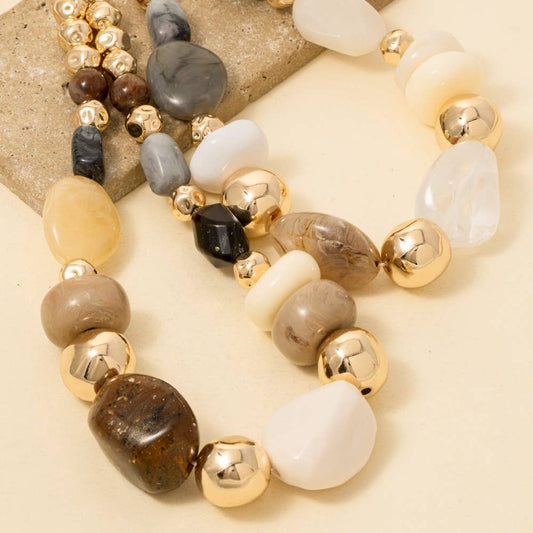 Necklace with multicolored beads on a neutral background