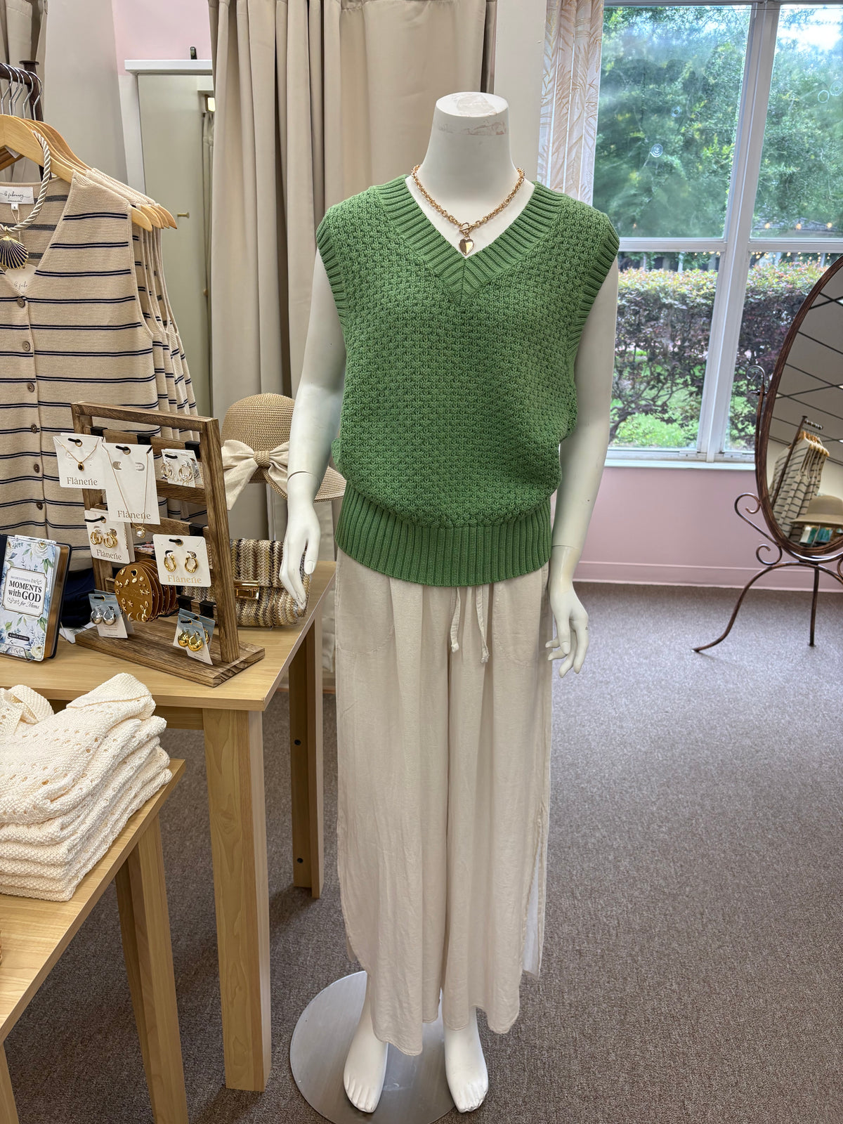 Antonella knit vest by Varley displayed on a model, featuring a cozy, stylish design in a soft, neutral color.