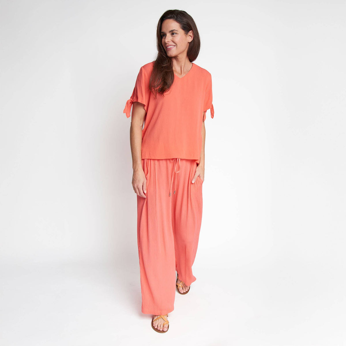 Elsie & Zoey Nika Crepe V-Neck Blouse with tied short sleeves, lightweight fabric, and a relaxed fit.
