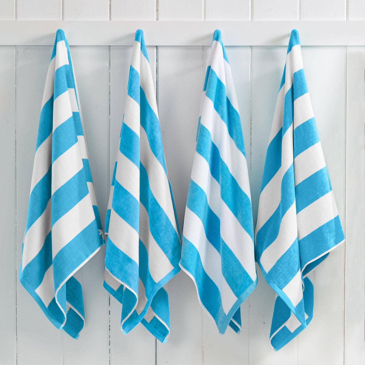Air Blue Cotton Velour Cabana Stripe Beach Towel from BH Collective's Novia Collection, oversized 35x70 inches, with bold stripe pattern.