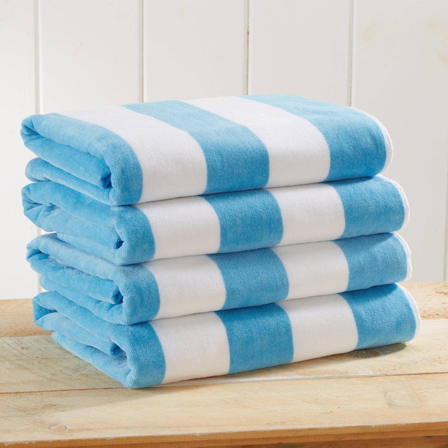 Air Blue cotton velour cabana stripe beach towel from BH Collective's Novia Collection, oversized 35x70 inches, with bold stripe pattern.