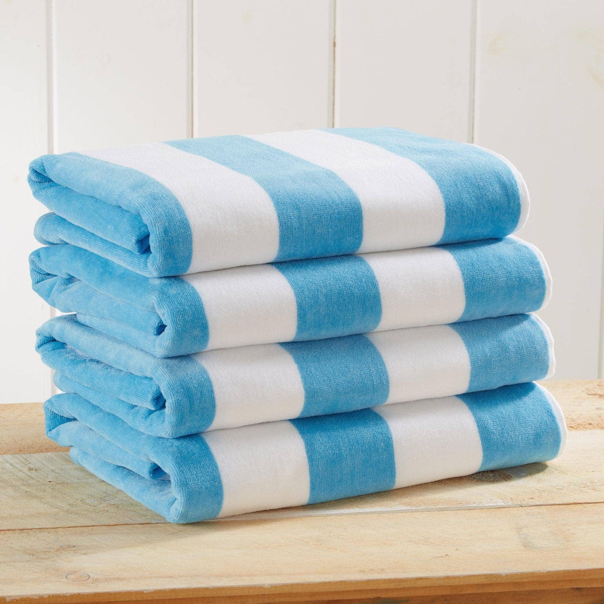 Air Blue cotton velour cabana stripe beach towel from BH Collective's Novia Collection, oversized 35x70 inches, with bold stripe pattern.