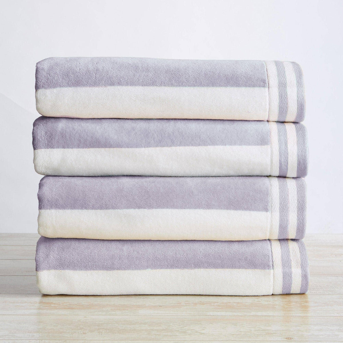 Oversized striped Cabana beach towel by BH Collective featuring colorful Edgartown design, perfect for lounging at the beach.