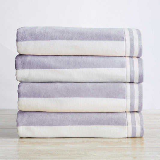 Oversized striped Cabana beach towel by BH Collective featuring colorful Edgartown design, perfect for lounging at the beach.