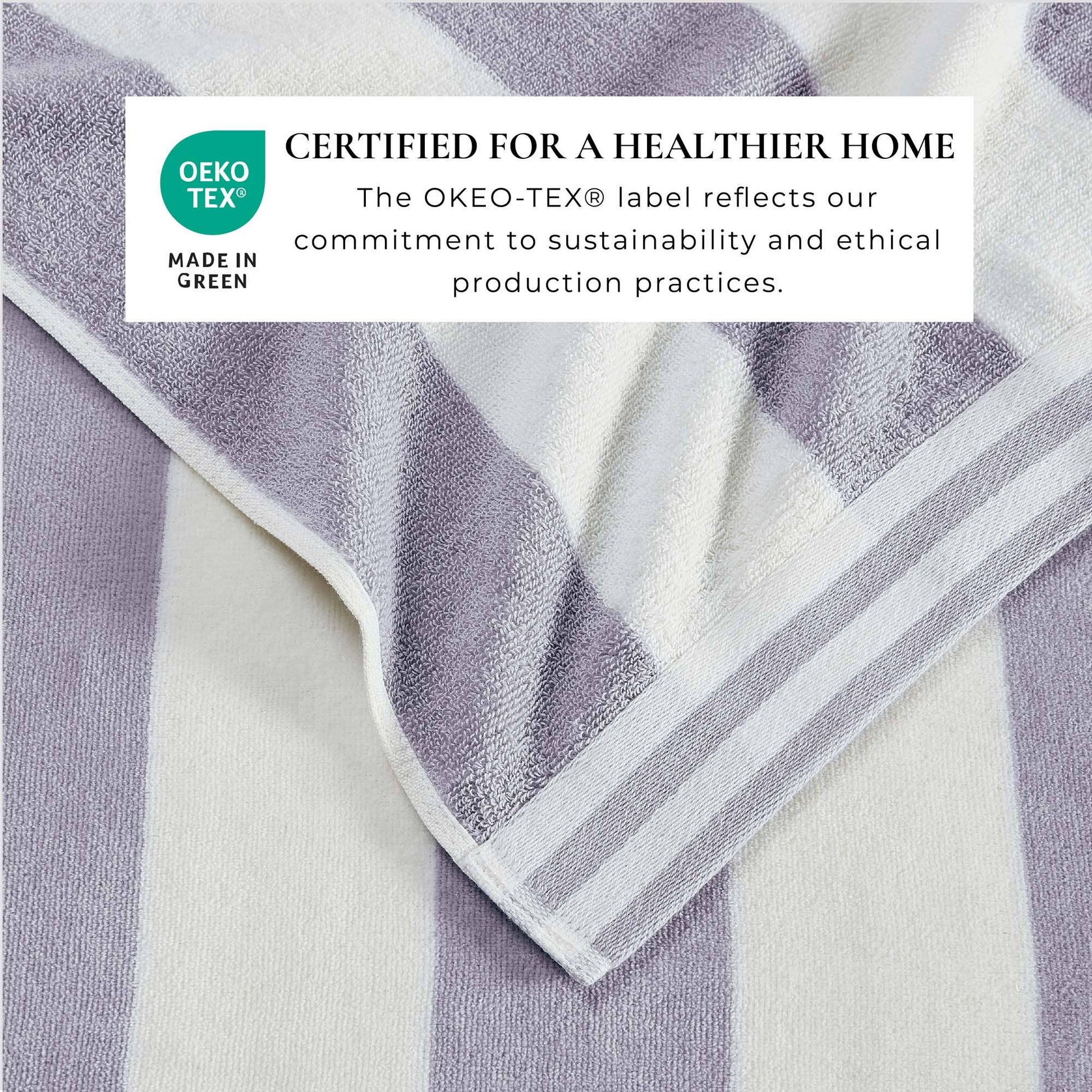 Large striped Cabana beach towel from BH Collective featuring colorful Edgartown design, laid flat on sandy beach.