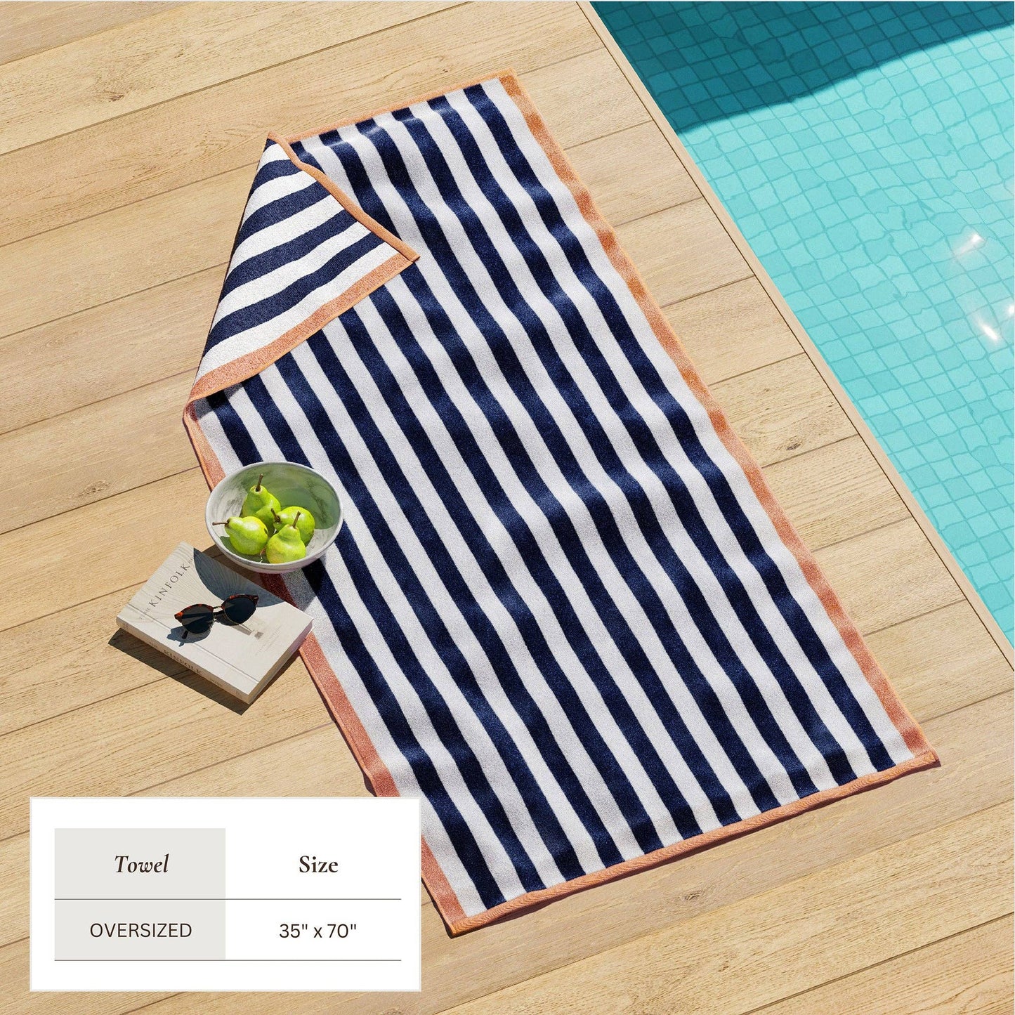 Oversized Santa Cruz striped border cabana beach towel by BH Collective, featuring colorful stripes and soft terry fabric.