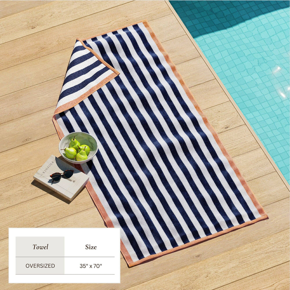 Oversized Santa Cruz striped border cabana beach towel by BH Collective, featuring colorful stripes and soft terry fabric.