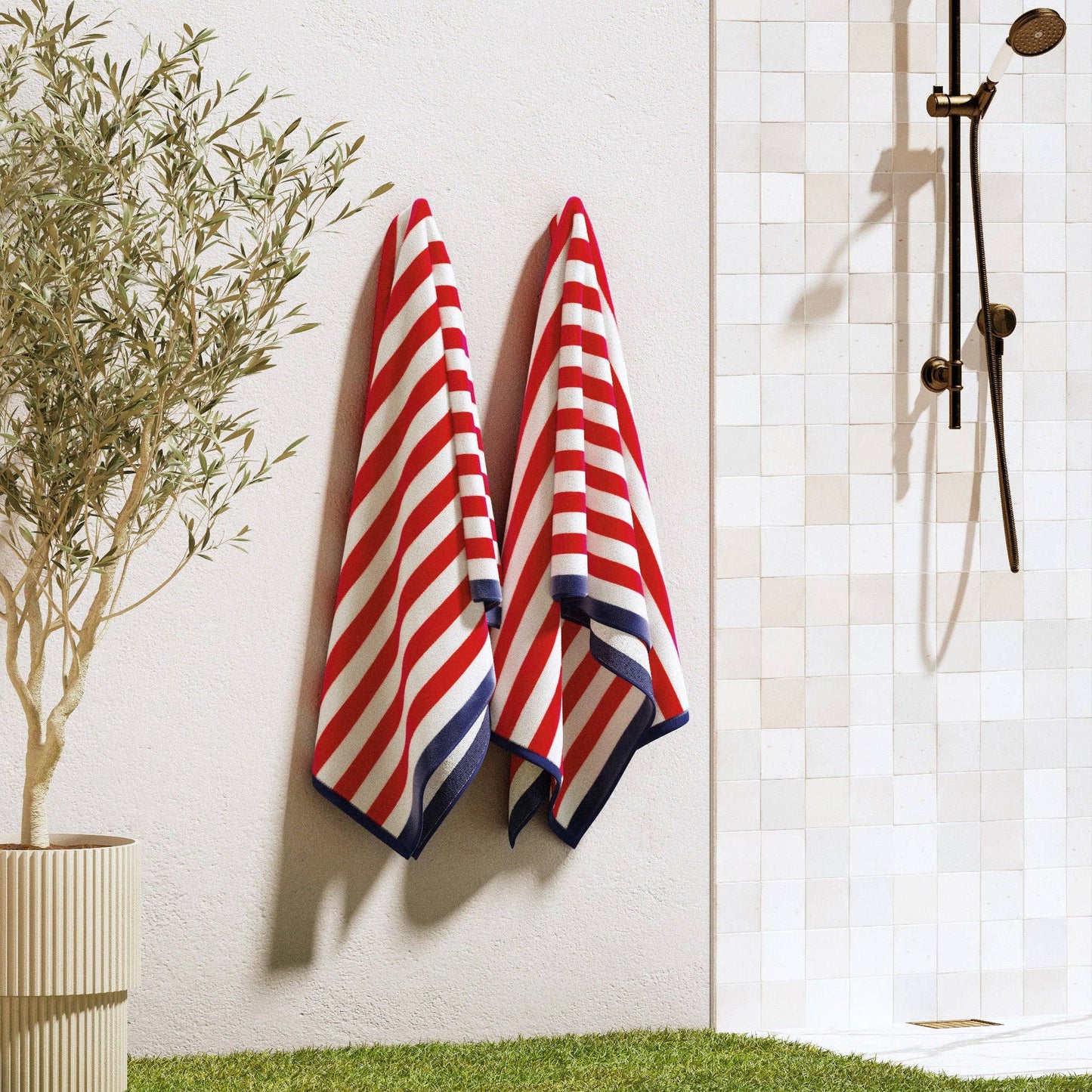 Oversized Santa Cruz striped border cabana beach towel by BH Collective, featuring colorful horizontal stripes and soft fabric.