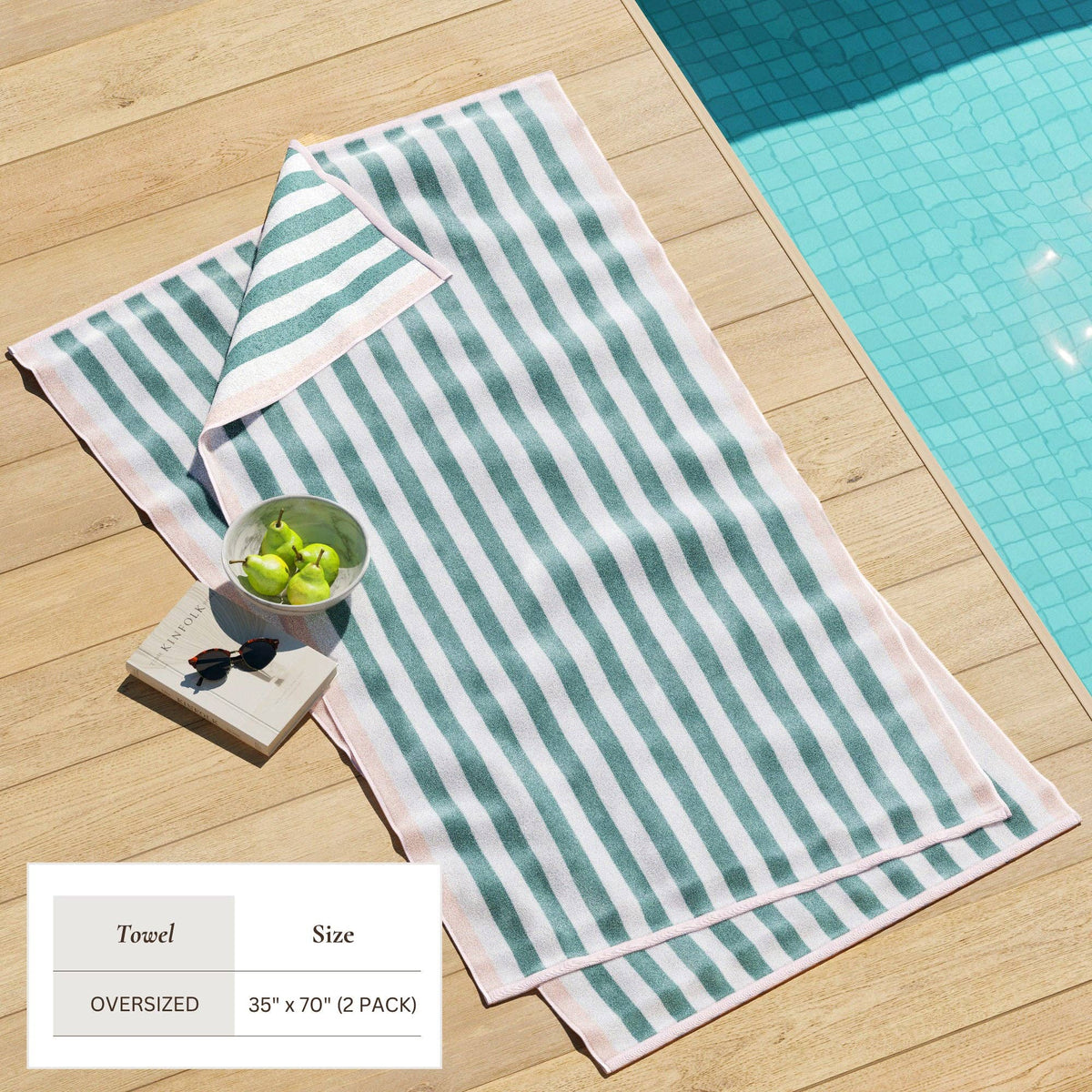 Oversized Santa Cruz striped border cabana beach towel by BH Collective, featuring colorful stripes and soft terry fabric.