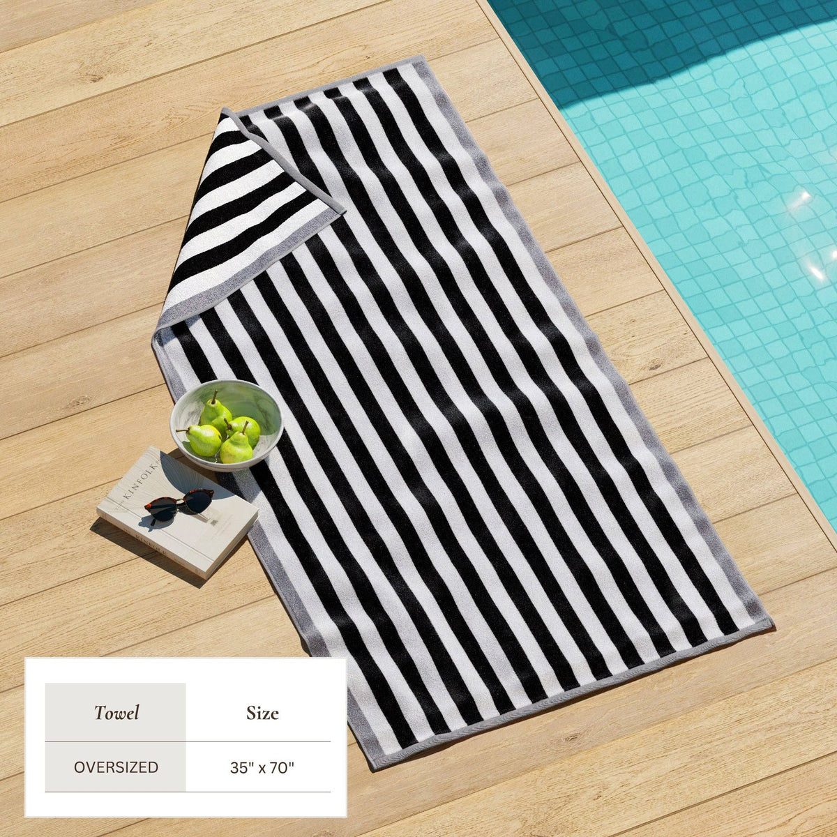 Oversized Santa Cruz striped border cabana beach towel by BH Collective, showing vibrant blue, white, and pink stripes on soft cotton fabric.