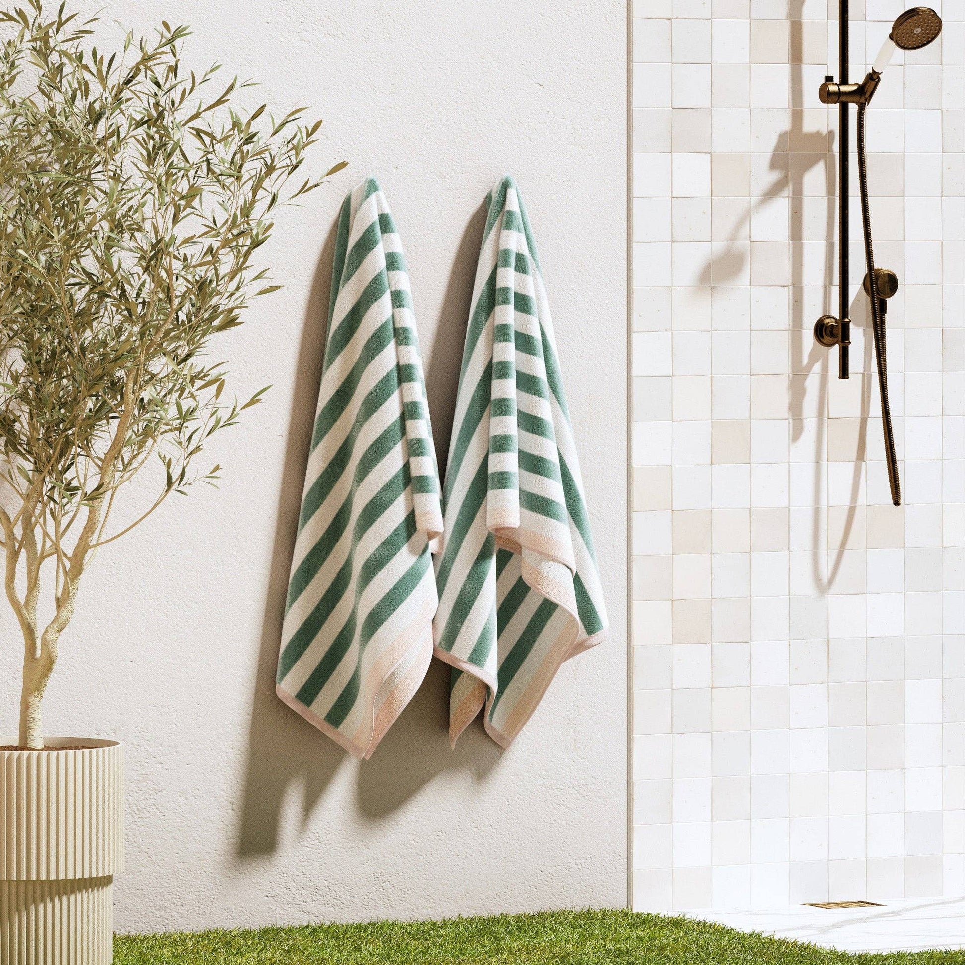 Oversized striped border Santa Cruz beach towel by BH Collective, featuring vibrant colors and soft cotton fabric.