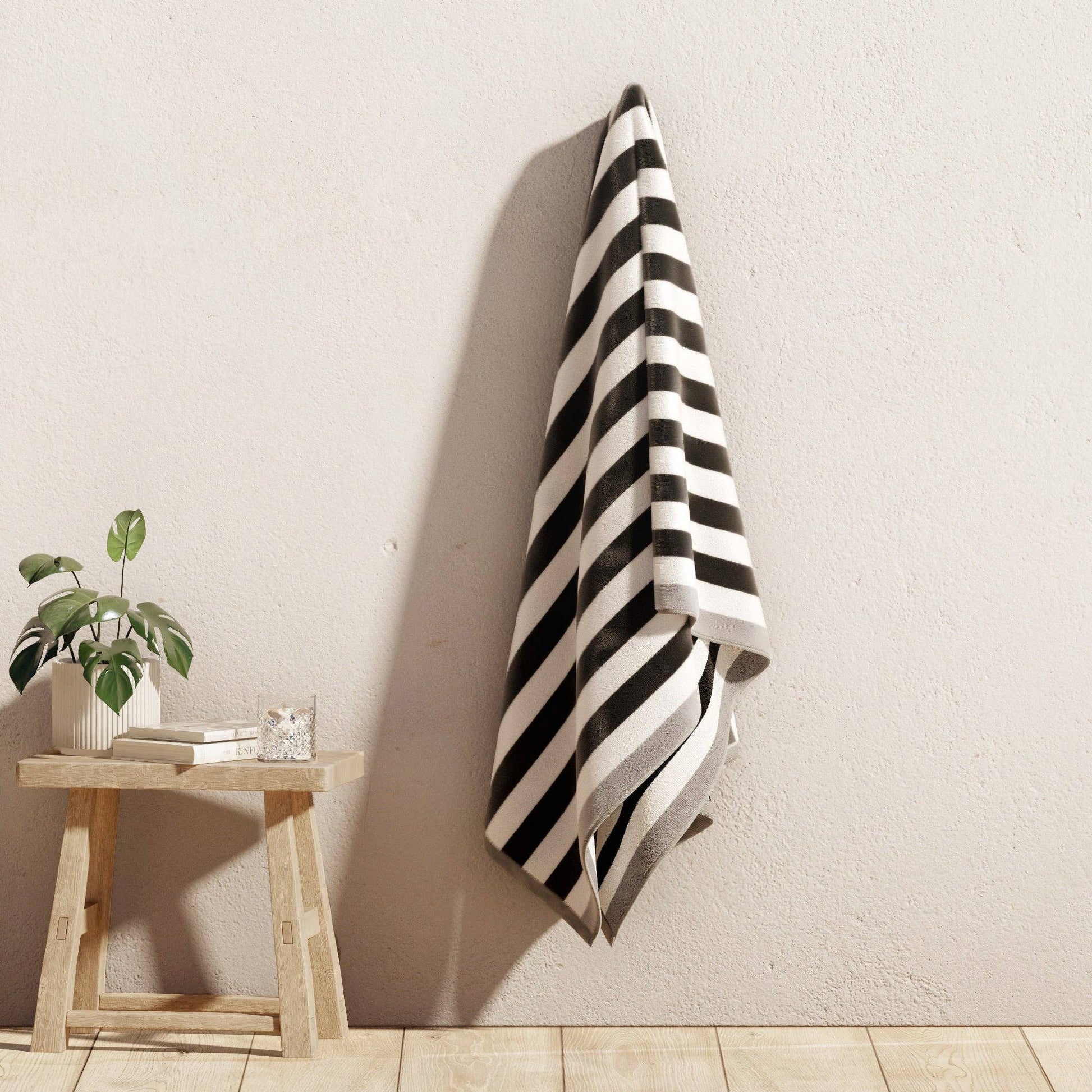 Oversized Santa Cruz striped border cabana beach towel by BH Collective, featuring bold colorful stripes for beach or pool use.