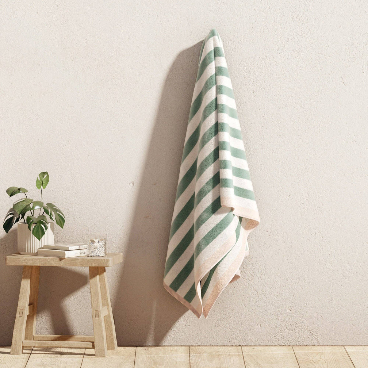 Oversized Santa Cruz striped border cabana beach towel by BH Collective, showing vibrant colors and soft, plush fabric.