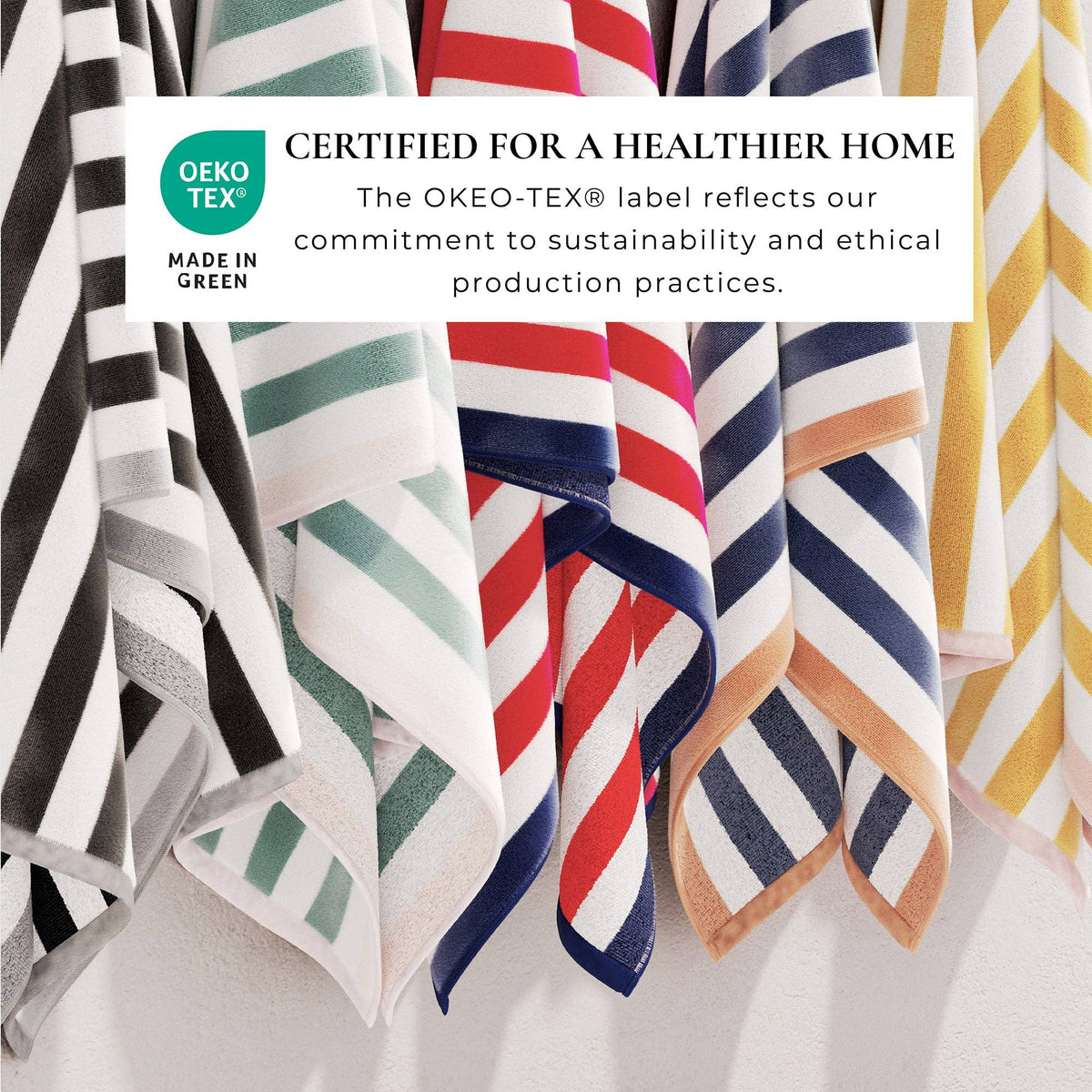 Oversized Santa Cruz striped border cabana beach towel by BH Collective spread out on sand, showcasing vibrant colors and soft terry fabric.