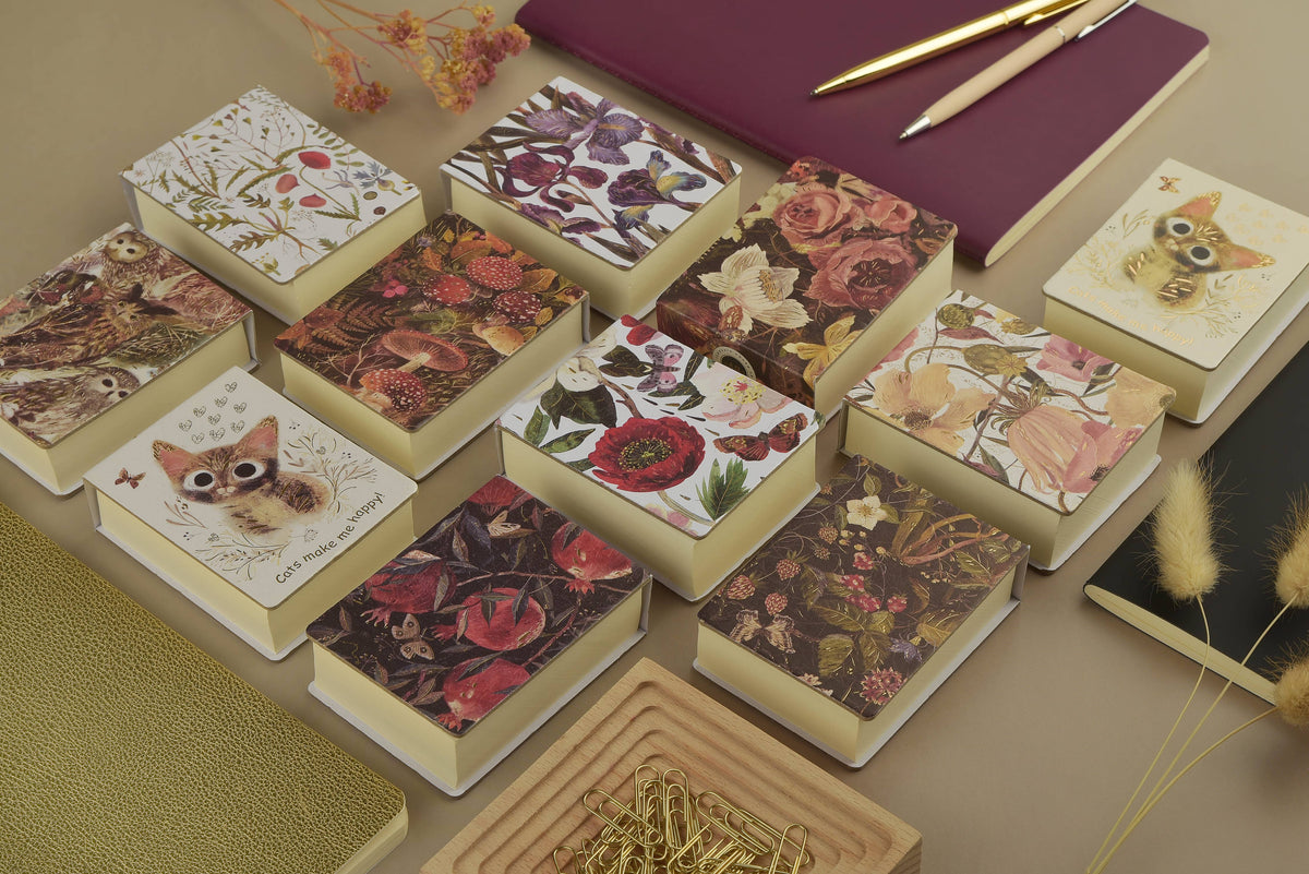 Tear-Away Notepad with lush bouquet floral cover by BV by Bruno Visconti, featuring colorful flower illustrations on the front page.