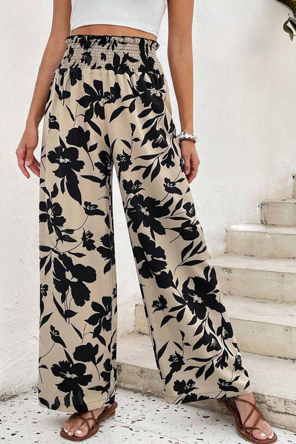 Floral pant with frill waist and wide-leg design by Chic Speak Boutique, featuring a stylish, flowy silhouette.